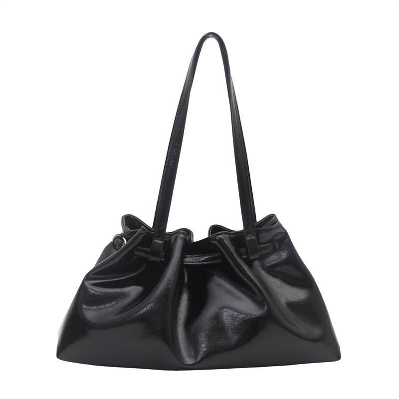 2025 moda pliegue sensación de bolso de mujer coreana brazo bolso de mano de calidad europea y americana de piel de cera de aceite bolso de hombro de viaje universal
