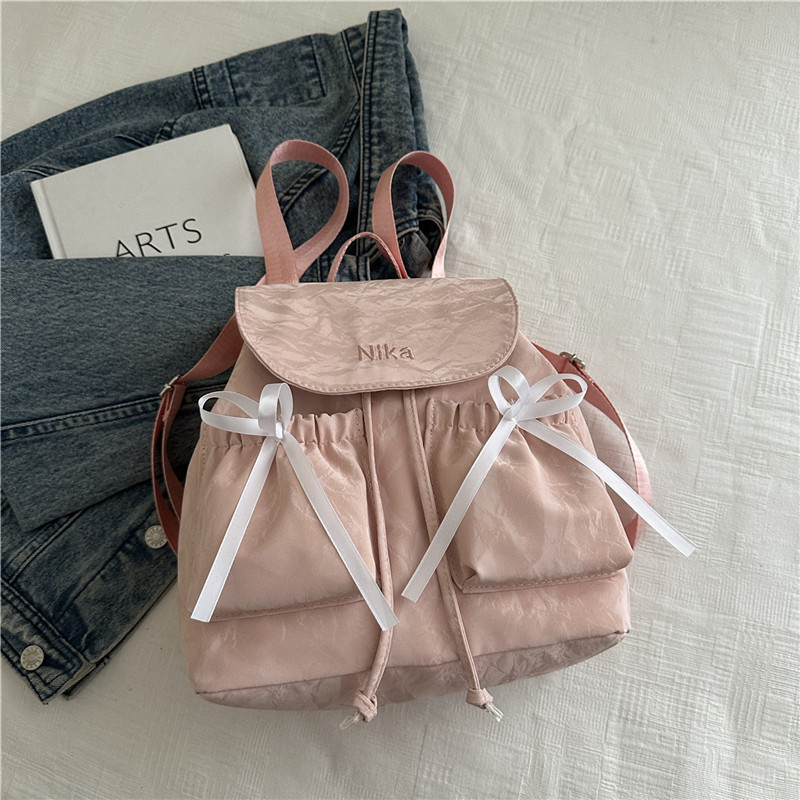 Mochila de lazo de sentido de alta gama para mujer 2025 nueva moda mochila de viaje mochila escolar casual para estudiantes coreanos
