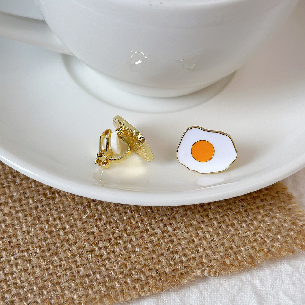 Versión coreana del temperamento de camelia, sin orejas perforadas, pinza para la oreja, flor de perla, tablero de ajedrez, pinza para la oreja triangular con diamantes, pendientes de nicho para mujeres