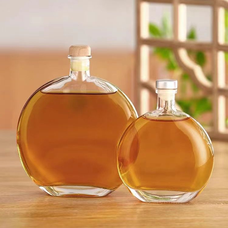 批发新款圆形玻璃饮料瓶透明创意便携式扁果汁瓶咖啡奶茶瓶饮水杯