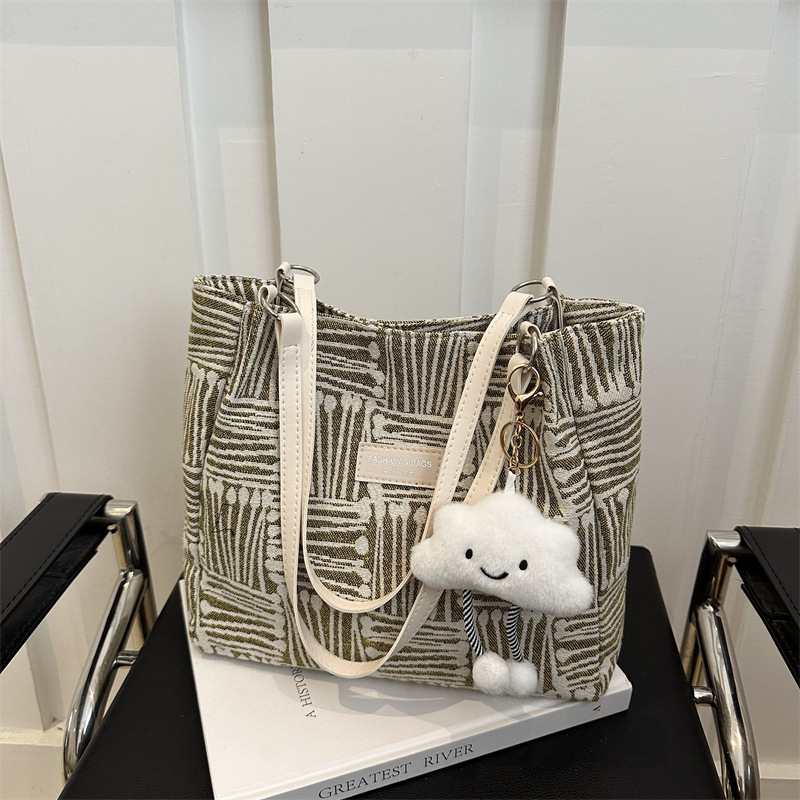 Bolso a rayas casual de todos los partidos de nicho para mujer 2024 nuevo bolso de hombro de gran capacidad de moda retro bolso de viaje