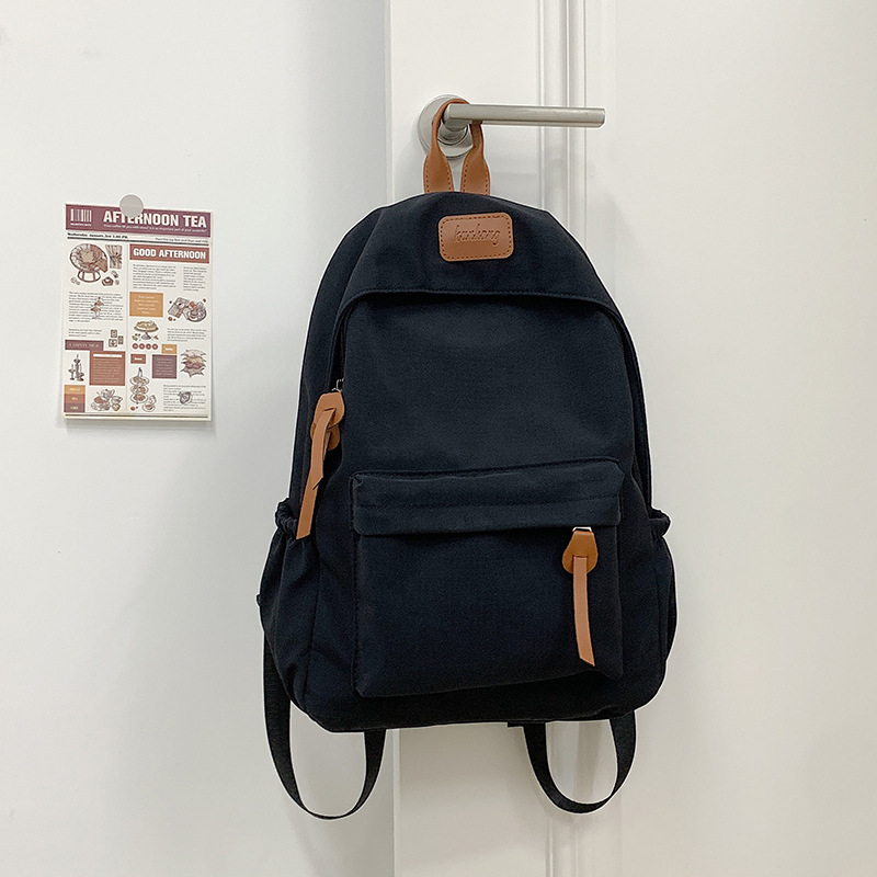 Mochila de nylon para mujeres 2024 nueva moda, bolsas escolares ligeras de color sólido, mochila de clase coreana para estudiantes de secundaria.