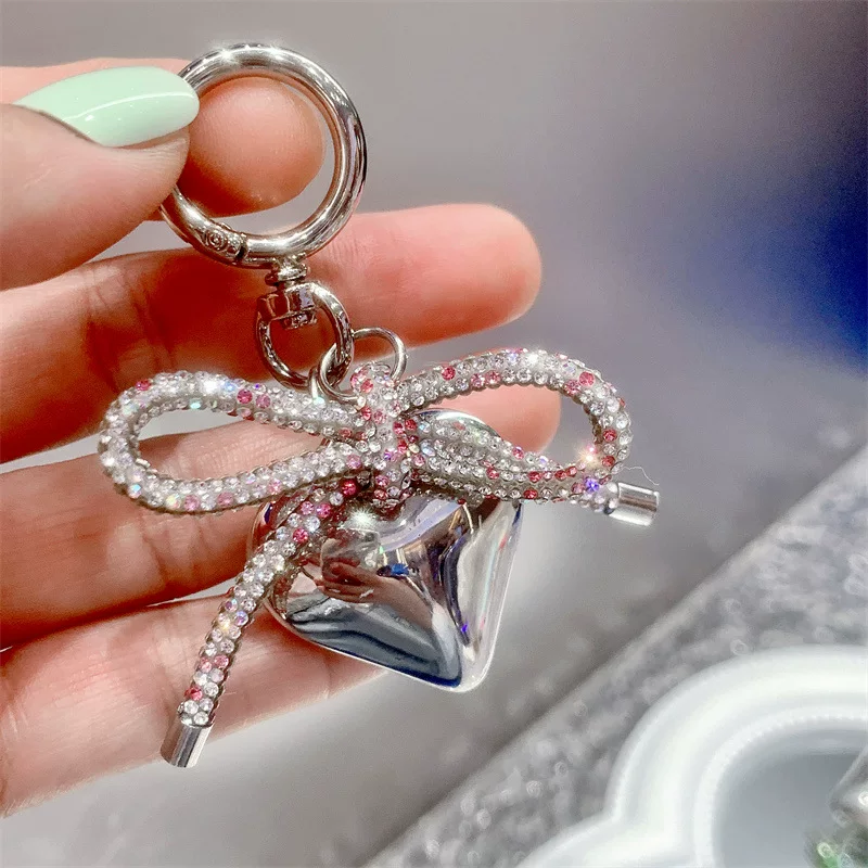Small mobile phone with bow, pendant, diamond encrusted