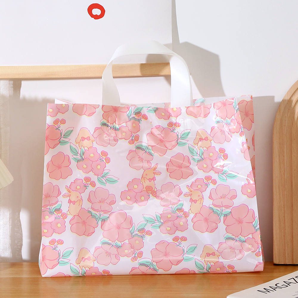 Bolsas de regalo de plástico personalizadas impresión logotipo bolsas de ropa personalizadas bolsas de goma de compras ropa de mujer portátil