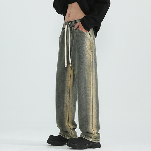 Vintage-style distressed washed denim jeans for men—trendy, loose-fit, straight-leg casual trousers for spring and autumn