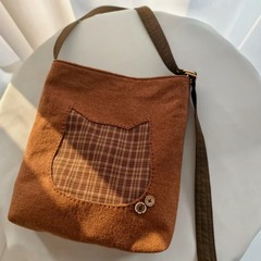 2025新型日系猫の顔がズックバッグを斜めに掛けています。