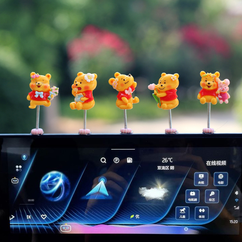 Nueva decoración de coche de oso amarillo lindo de dibujos animados coche consola central de navegación decoración de pantalla sacudiendo la cabeza gancho pegajoso