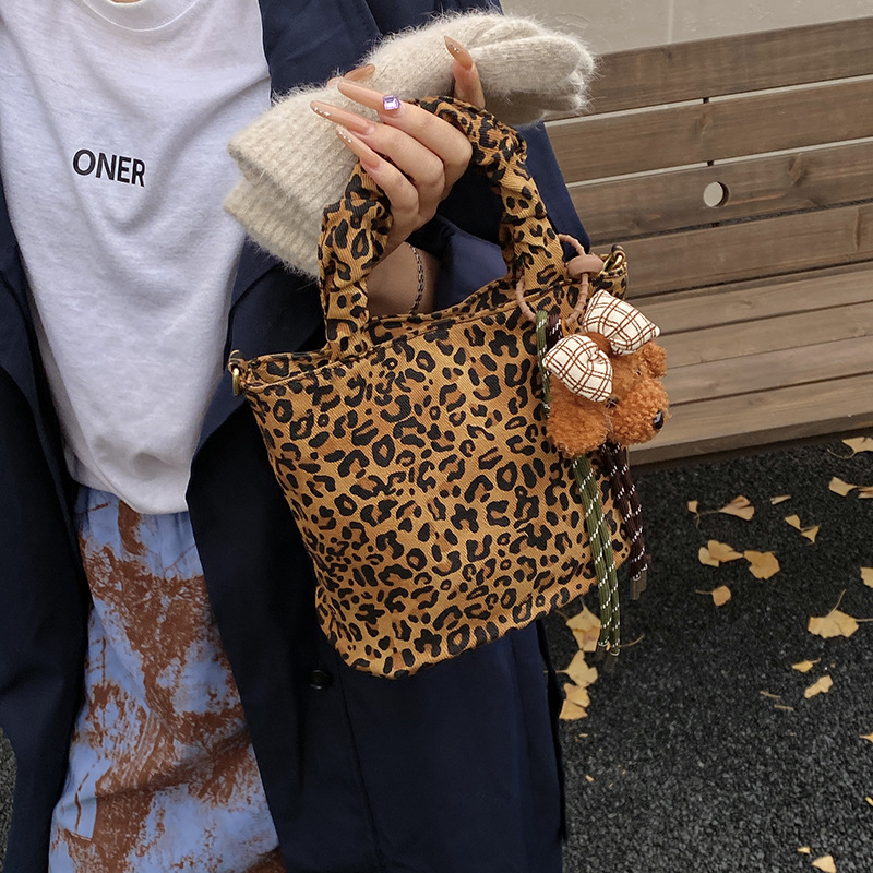 Moda leopardo bolso de niña lindo perro colgante mochila de niño otoño y invierno nuevo bolso de niños de peluche