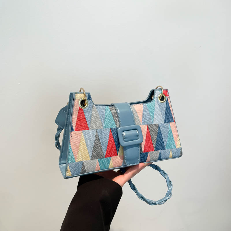 Nicho de diseño geométrico empalme brazalete bolso de hombro para mujeres 2025 primavera nueva textura bolso de hombro