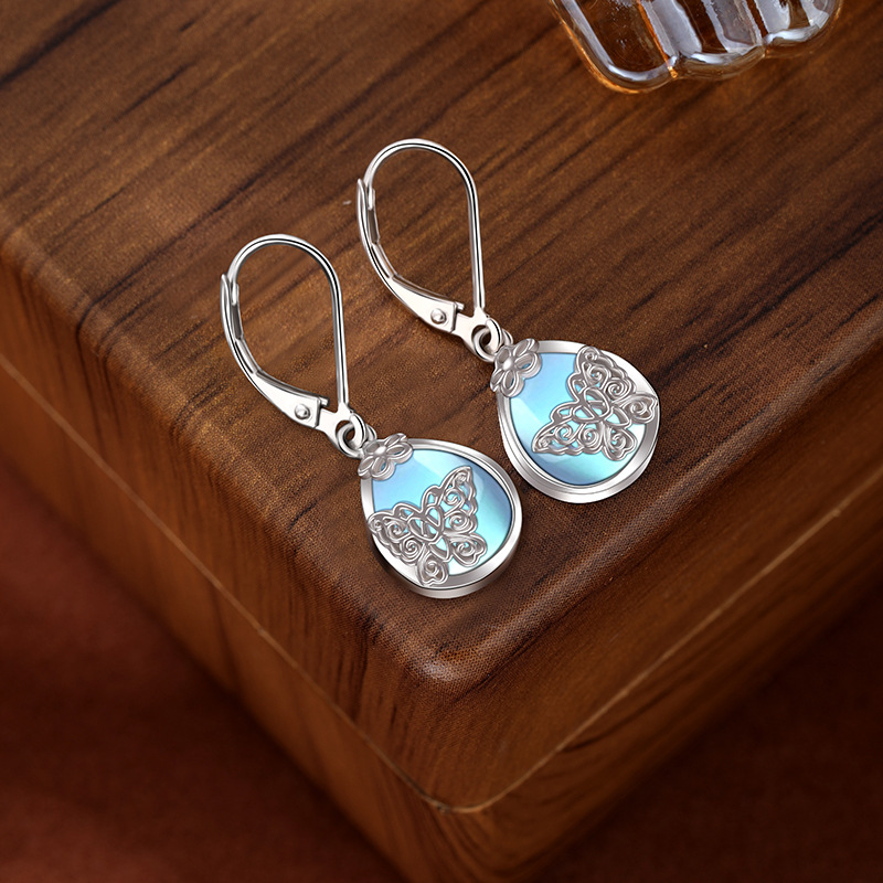 925 aretes de mariposa de flores de plata esterlina para mujeres lujosas europeas y estadounidenses de alta sensación de auriculares de piedra de luz de la luna Amazon auriculares transfronterizos