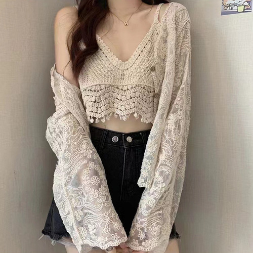 A lightweight summer shawl-style dress with spaghetti straps, paired with a lace open sweater for a fairy-like effect. It's a super fairy-like top and provides great sun protection.