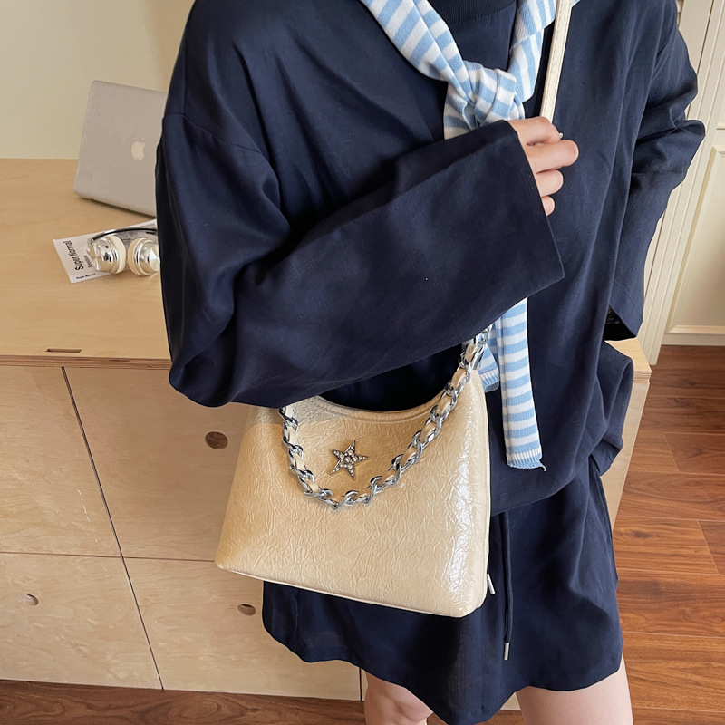Bolsa de cadena de textura de alta calidad 2025 verano nuevo estilo bolso de hombro con patrón de agarre bolso de mensajero de estrella de diamantes mujer
