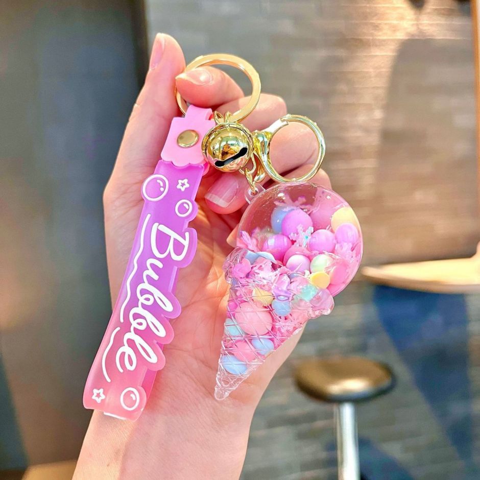 Arenas flotantes transfronterizas coloridas frijoles botellas flotantes de helado llaveras de chicas bolsos colgantes de arena flotante pequeña decoración colgante para mujeres