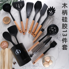 木の柄のシリカゲルの調理器具の13点セットは桶を収納して台所の道具を詰めます。