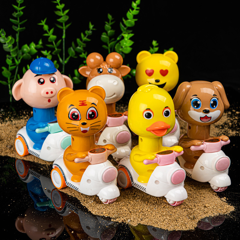 Presione pollos perros cerdos ganado panda dibujos animados inercia retroalimentación motocicleta juguetes para niños estand de suministro al por mayor pato amarillo