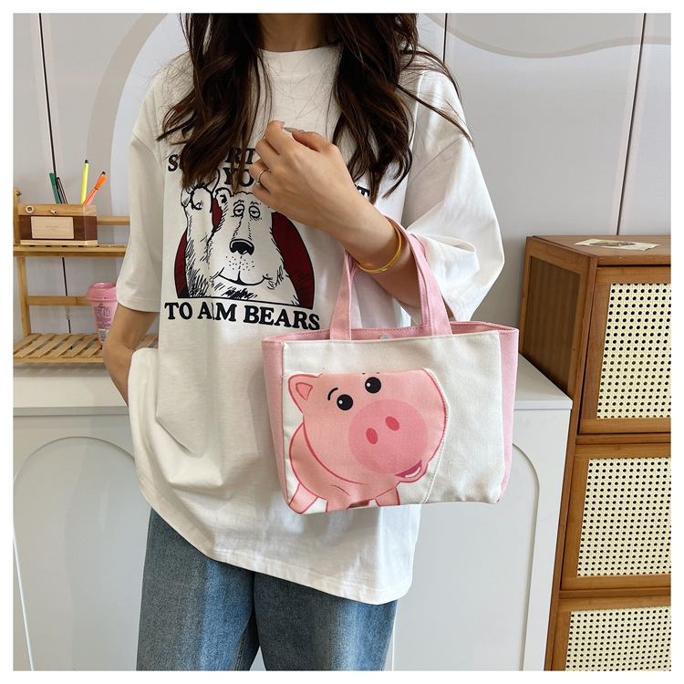 Cute cartoon printed small bag, 2024 summer new style hand-held piggy girl handbag, student storage canvas bag undefined