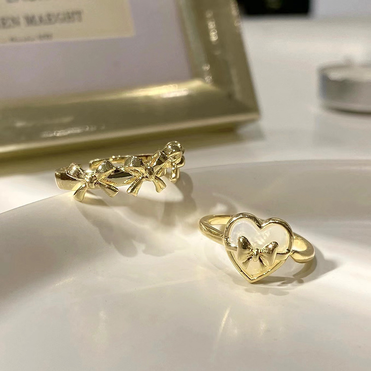 Elegant golden design adjustable ring with bow