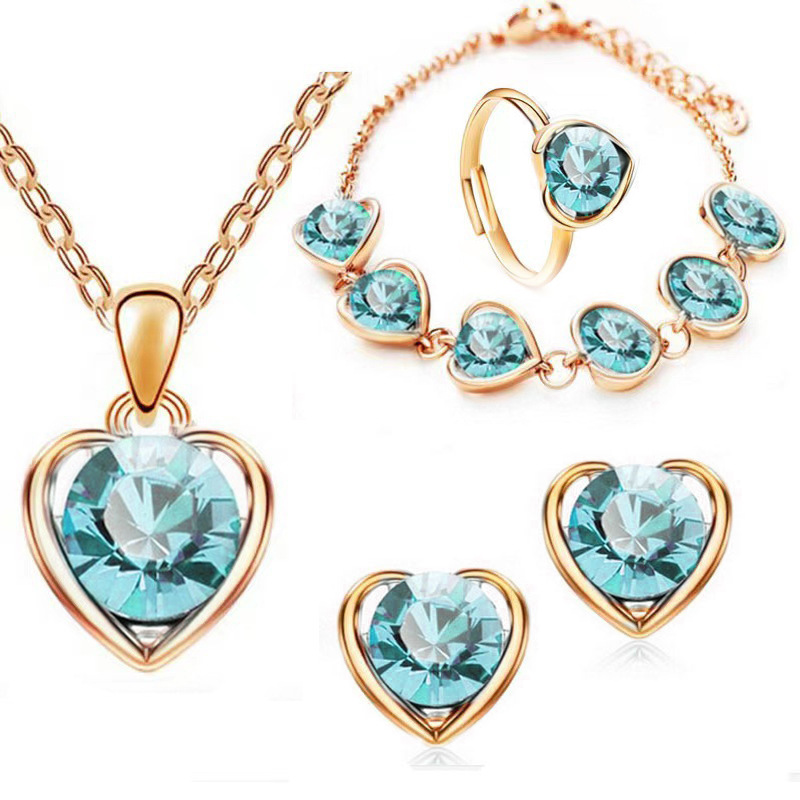 Venta caliente transfronteriza joyería en forma de corazón de cristal traje personalidad femenina temperamento corazón collar pendientes anillo pulsera conjunto de cuatro piezas