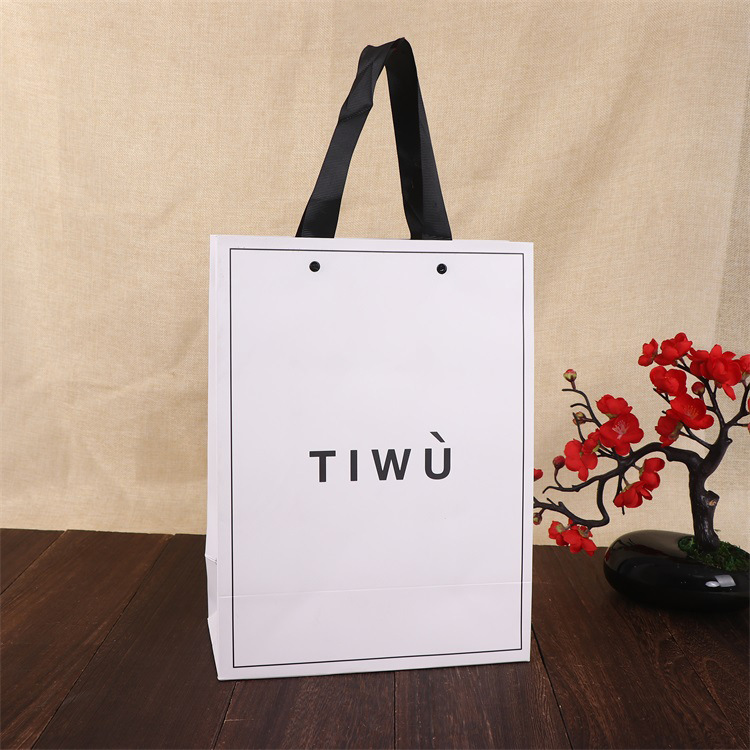厂家供应白卡纸礼品袋 服装店手提购物袋 通用广告茶叶包装袋批发