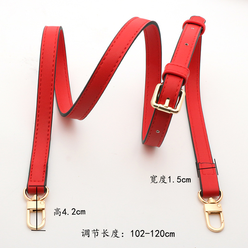 Crossbody with big red pin buckle