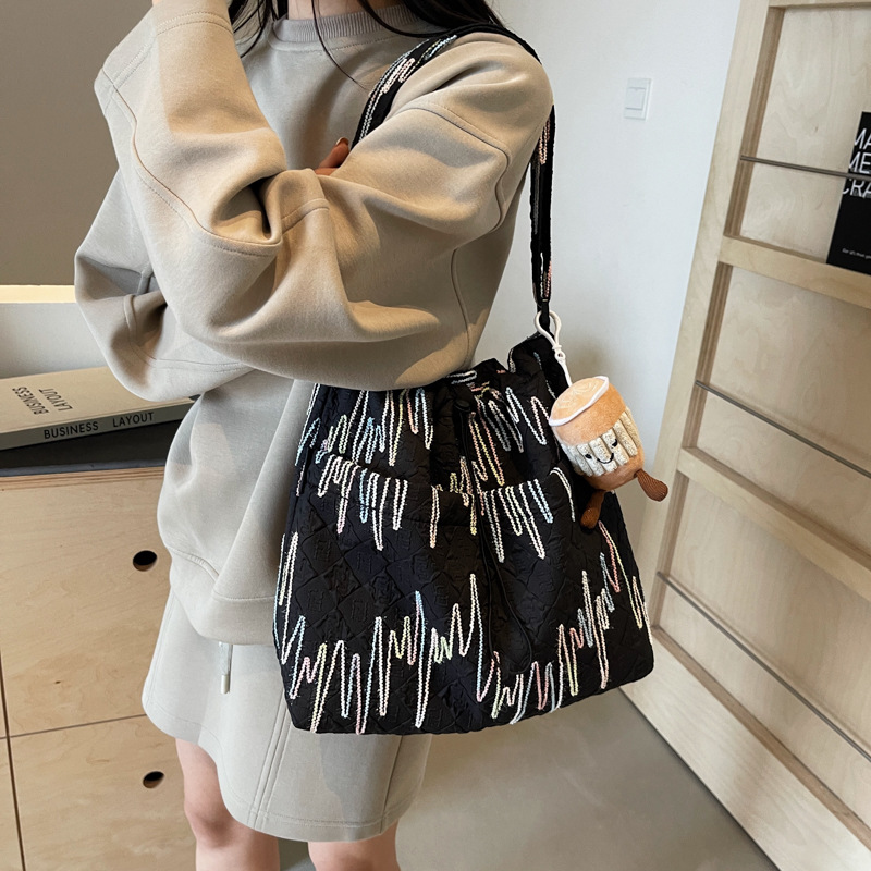 Estilo occidental todo-fósforo bolso de ocio bolso de mensajero mujer 2025 nuevo bolso de cubo de moda simple bolso de lona de viaje para estudiantes