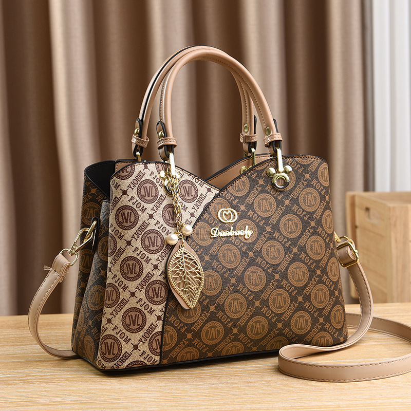 Bolso bandolera para mujer nuevo versátil bolso de mamá moda de verano bolso de mano de un solo hombro 2025 fabricante comercio exterior elegante para mujer.