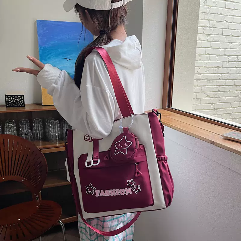 学生单肩包女韩版拼色字母斜挎包中小学生手提大容量补习袋女批发