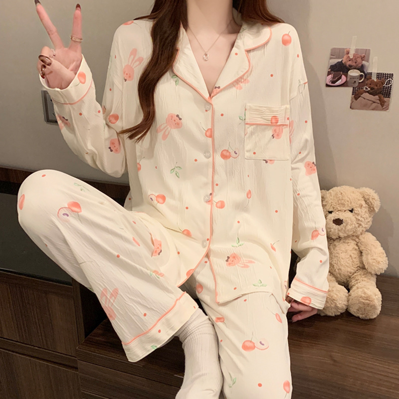 蝶結びのさくらんぼのプリントの女性のパジャマの春と秋の新型のカーディガンの長袖のズボンの部屋の服のスーツは実際に卸売りをたたきます。|undefined