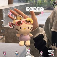 新しいラベンダーの紫色のスカートkt猫のぬいぐるみはサングラスの小さい花の王女のキーホルダーを掛けます。
