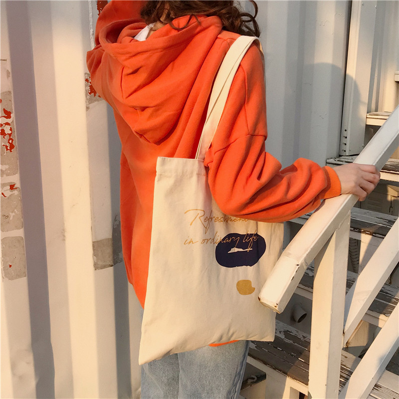 E131 canvas bag, Korean-style ins hand-held shoulder bag, color block letter graffiti shopping bag, female student's search for sources undefined