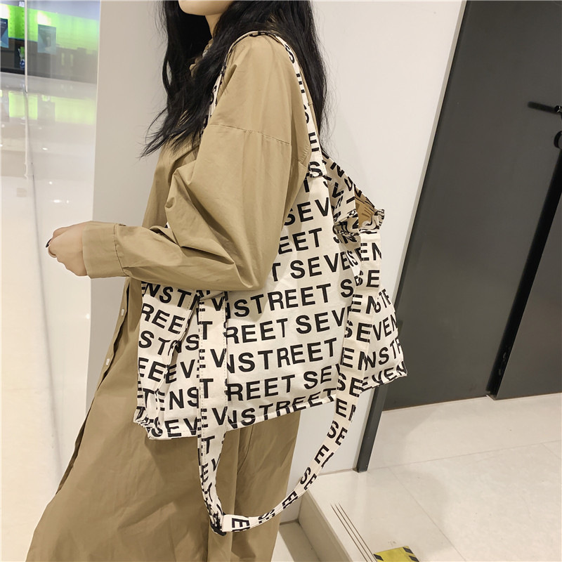 Bolso Tote de lona de gran capacidad para mujer 2024 nuevo bolso de hombro de estilo occidental de moda casual bolso de mensajero portátil de todo fósforo marea