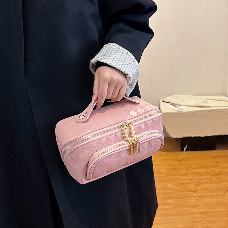 Nuevos bolsos de maquillaje transfronterizos pu-rango de nicho de moda de gran capacidad para mujeres bolsas de almacenamiento portátiles de viajes en línea bolsa de lavado roja