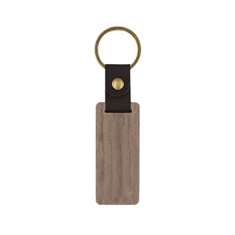 Llavero de madera de nogal negro de cuero spot logo tallado tronco de bambú pu cabeza de llavero colgante