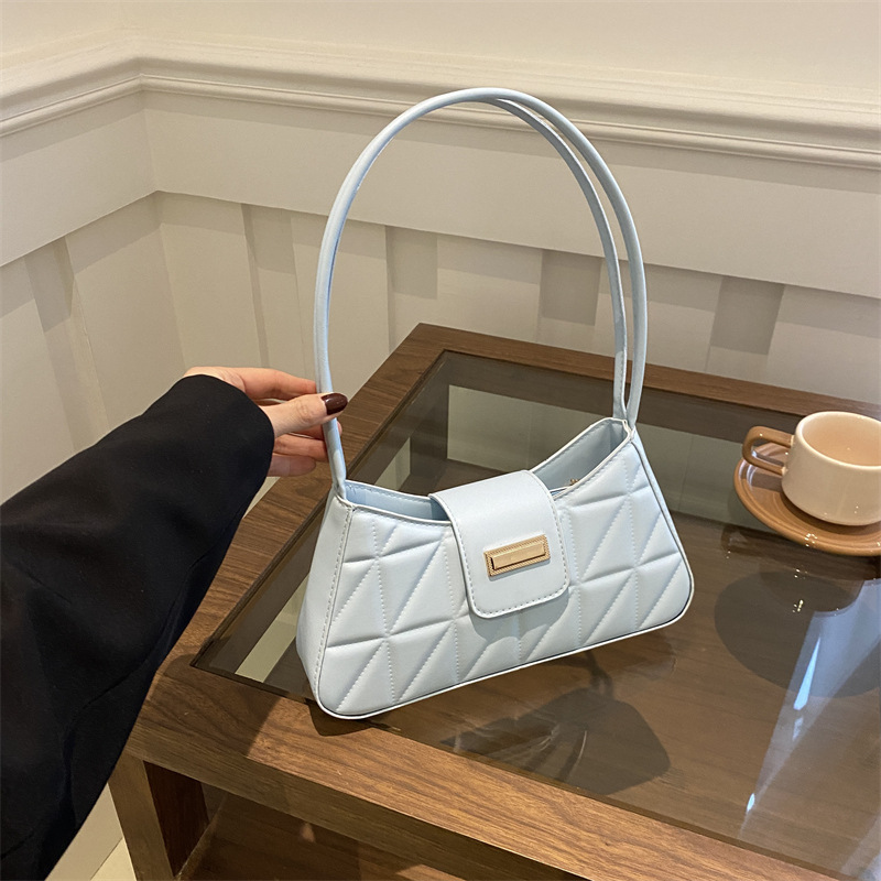 Bolso de nicho francés de textura occidental 2024 nuevo bolso femenino color sólido popular bandolera de hombro bolso de palo francés de axila