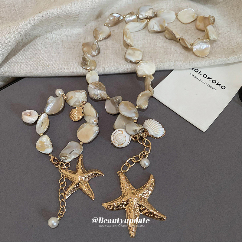 Collar de perlas de estrella de mar con cuentas de estilo de vacaciones junto al mar, nueva cadena de clavícula transfronteriza, joyería de lujo ligera de alta gama de nicho para mujer