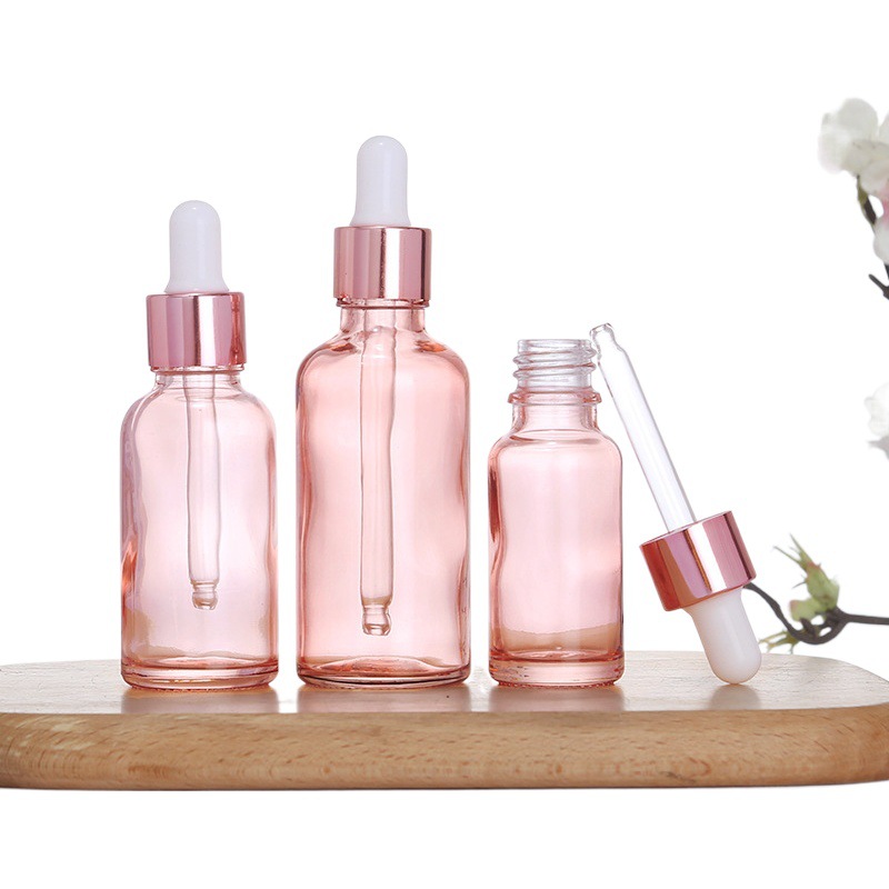 Botella de aceite esencial de color rosa transparente Esencia de líquido sub-botella gotero de vidrio Aceite de Masaje puro Rocío líquido sub-envasado de vidrio botella vacía