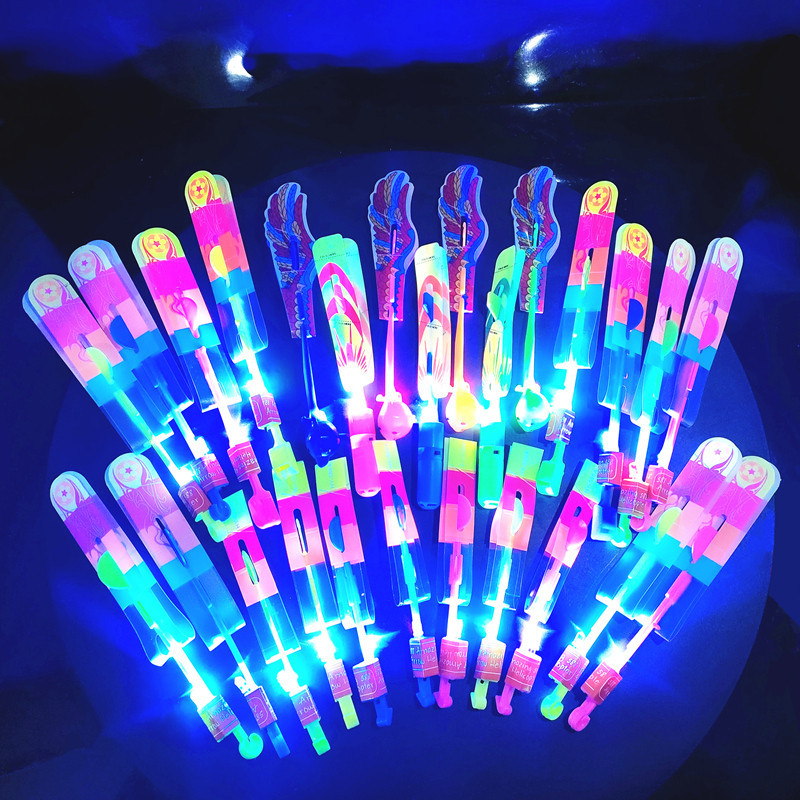 Mercado de la noche Venta caliente nueva catapulta luminosa flecha voladora puesto cuadrado catapulta luminosa flecha voladora juguetes pequeños luminosos para niños