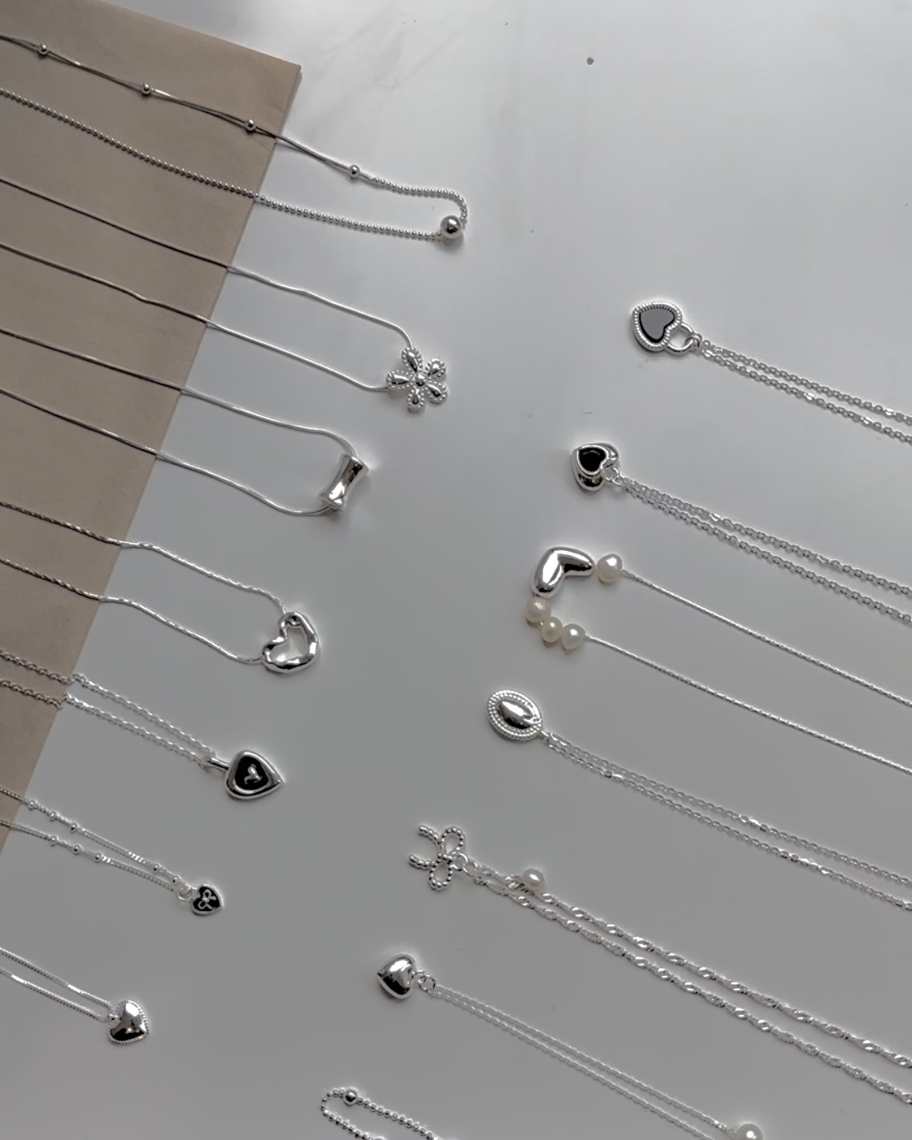 Collana con ciondolo a cuore e fiocco in argento, catena a strati_voghion.com