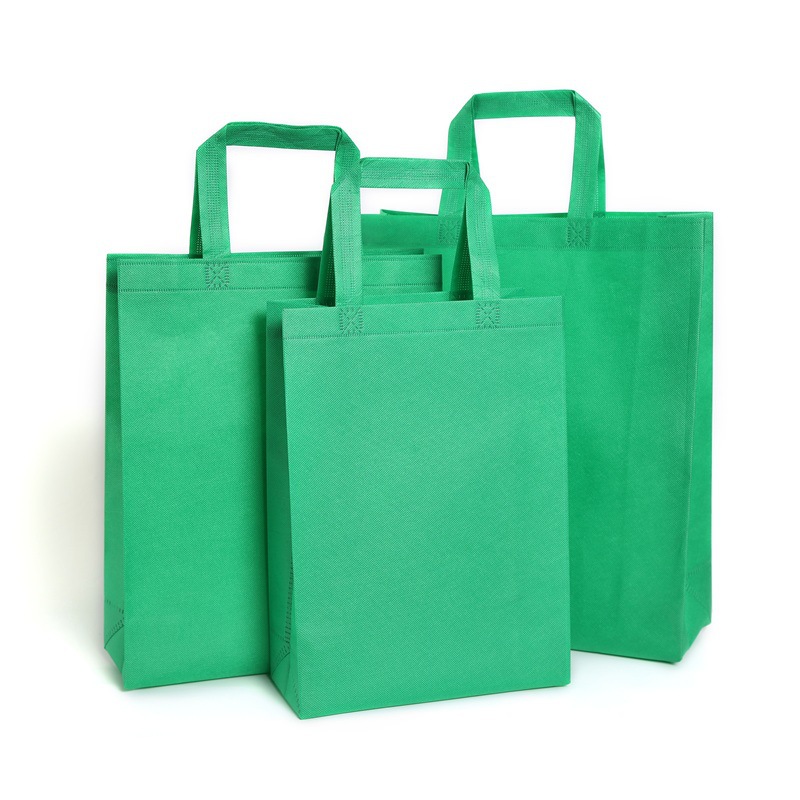 Bolsa de asas verde directa de fábrica bolsa de compras bolsa de chaleco bolsa de publicidad logotipo de película de color bolsa no tejida en stock
