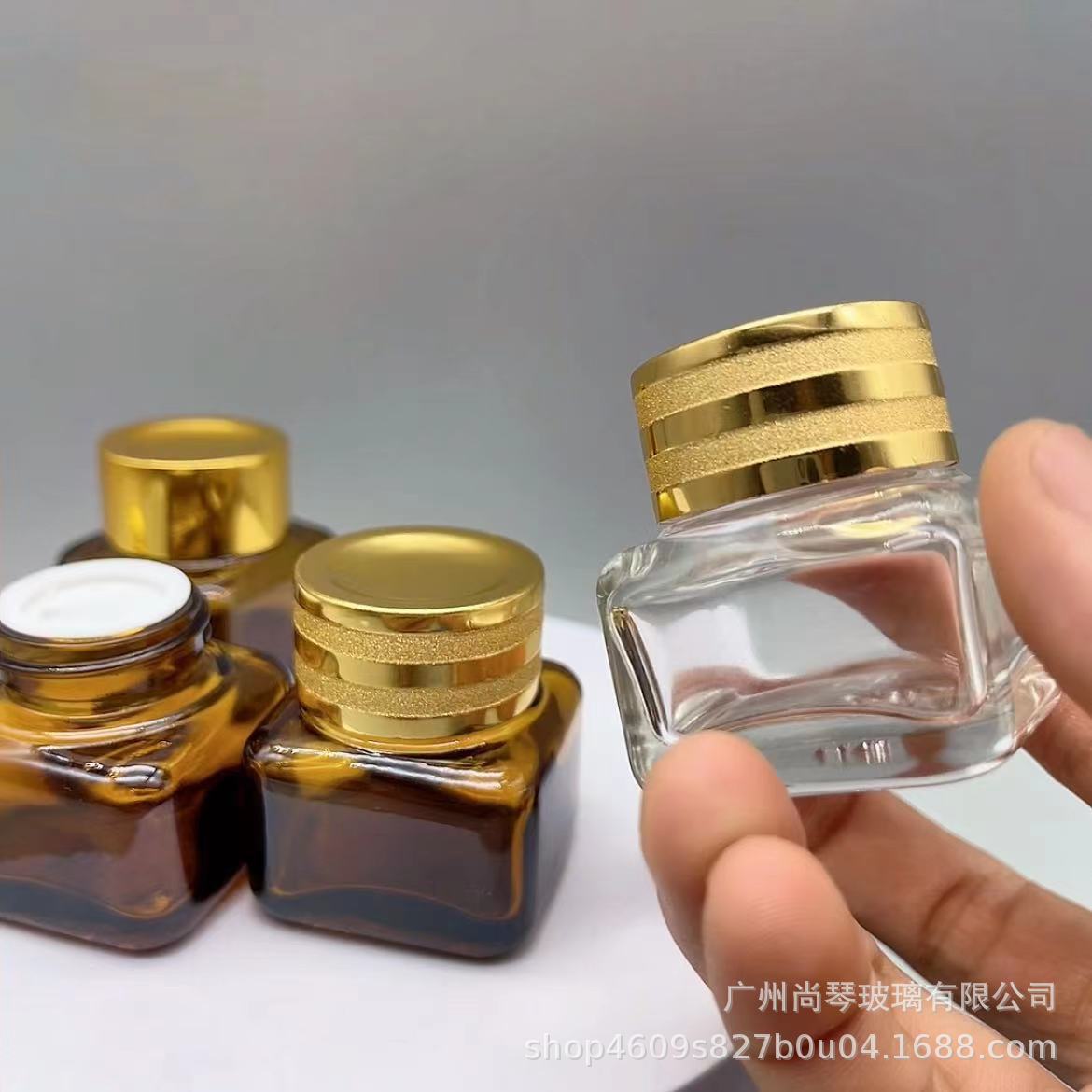 En stock suministro 15g Yashi mismo estilo marrón/transparente cuadrado ojo crema botella de vidrio de fondo grueso botella de vidrio cosméticos sub-embalaje