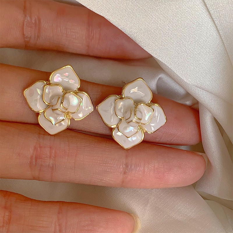 Aguja de plata flor pendientes geométricos pendientes dulces pequeños frescos de Corea del Sur ins moda nicho pendientes