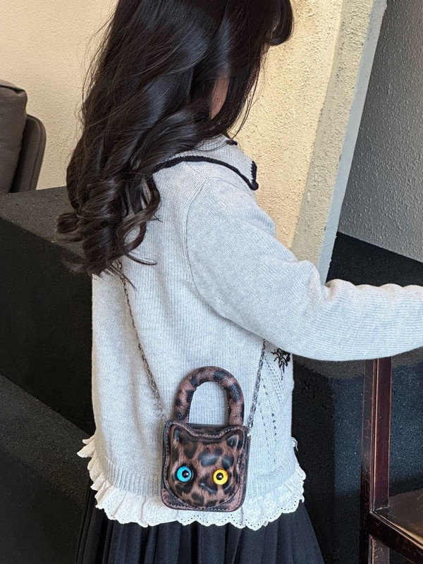 2026 bolsas de niños transfronterizas nuevas moda niños divertidos lindos bolsas de mano de gato tridimensionales padres e hijos mini bolsas de lápiz labial