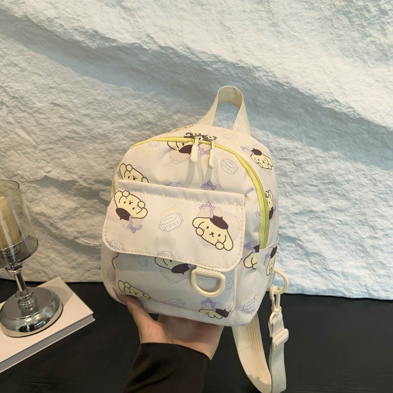 Mochila nueva al por mayor 2025, mochila de tela Oxford con diseño de dinosaurio de dibujos animados, mochila pequeña de gran capacidad para actividades al aire libre y ocio.