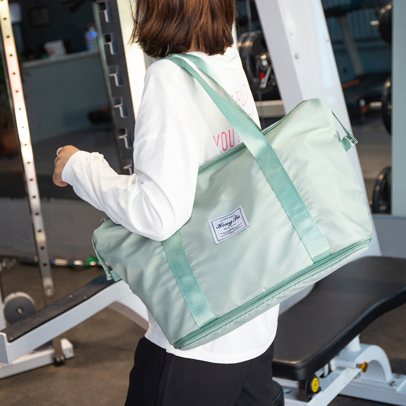 Bolsa de viaje de corta distancia portátil de gran capacidad bolsa de equipaje impermeable de moda para mujer bolsa de embarque de almacenamiento de viaje para hombres