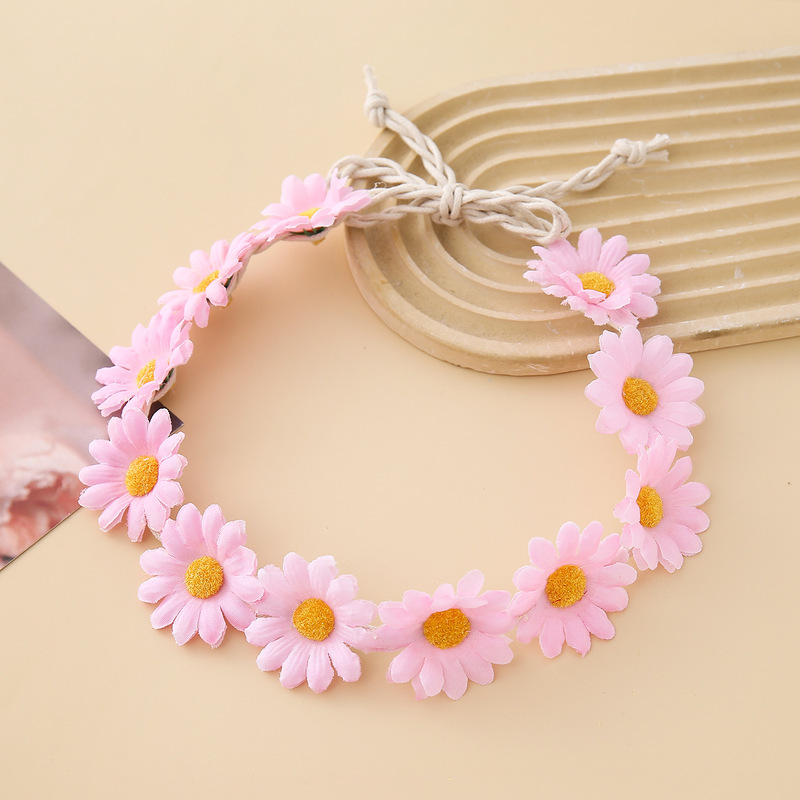 女性の女の子のヘアバンドは11輪の花の頭を編んで小さい太陽の花を持って旅行します。|undefined