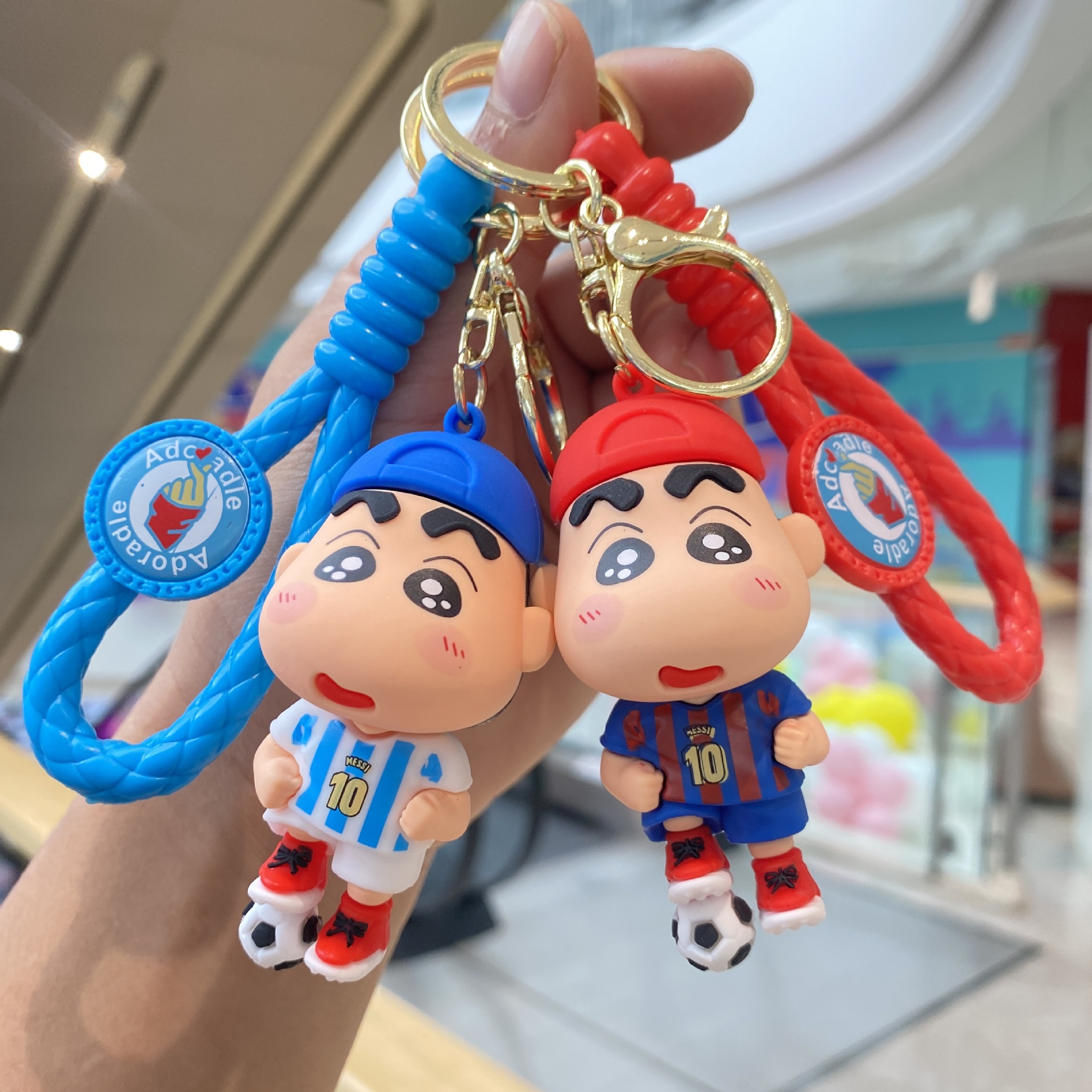 Nuevo fútbol crayón pequeño Nuevo llavero coche colgante muñeca máquina pequeño regalo llavero al por mayor