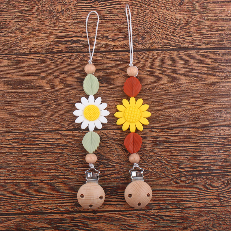Nuevos suministros para bebés clip de chupete de haya calmante bebé girasol mordedura de silicona chupete cadena anti-caída de la cadena