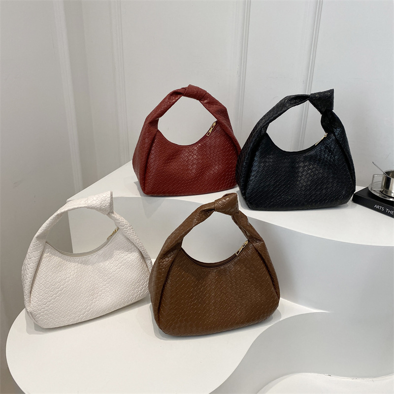 Casual retro de gran capacidad bolso de hombro de color sólido 2025 nuevo estilo de moda extranjera literatura y arte tejido brazaleta