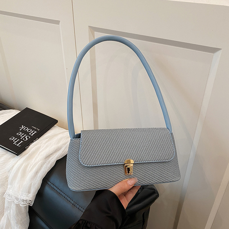 Bolsos de diseño de nicho de ocio para mujer 2025 nuevo bolso de axila de un solo hombro de moda de primavera bolso de palo de mano de moda