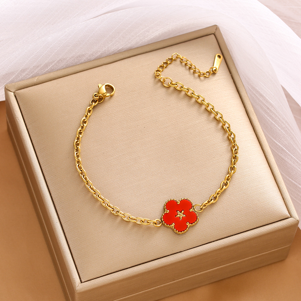 Pulsera de trébol de acero titanium vendedora caliente transfronteriza europea y americana con incrustaciones de concha pulsera colgante pulsera de diseño avanzado sin desvanecimiento al por mayor